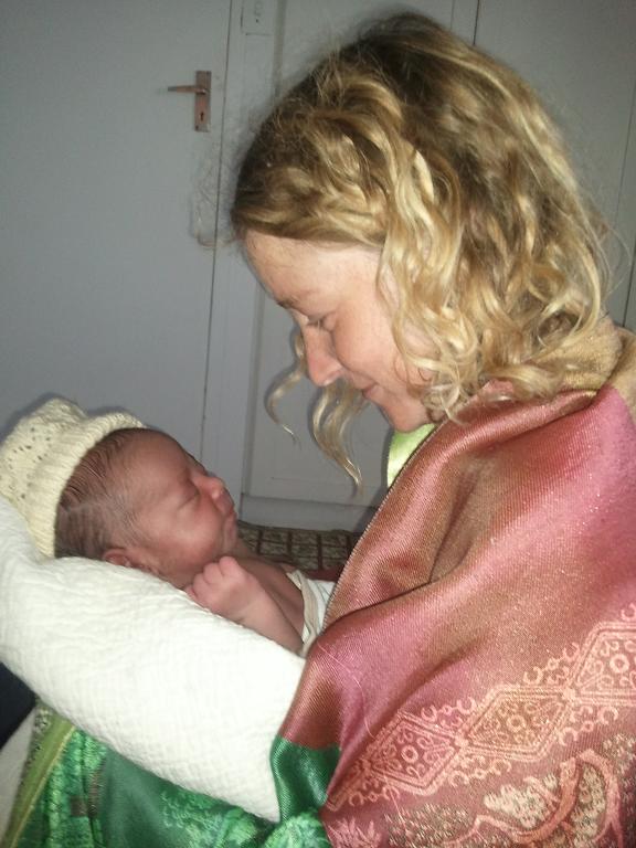 Lisa holding Tadiwa, her son who was born naturally
